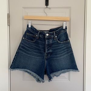 Good American The Bombshell Shorts in Medium Wash w/ distressing